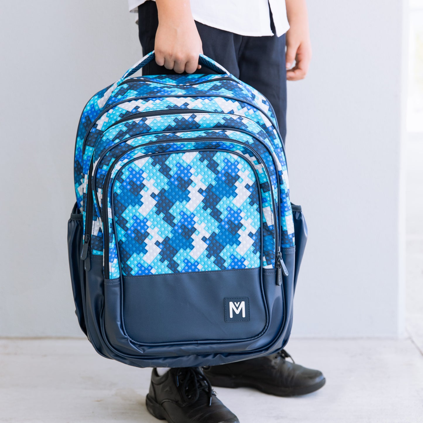 Montii.Co  Backpack - Block Land